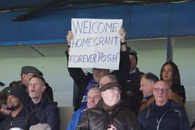 A Peterborough United supporter shows a signing welcoming new manager Grant McCann back to London Road. Photo: Joe Dent/theposh.com.