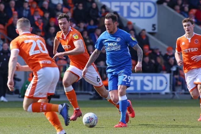 Lee Tomlin in action for Posh.