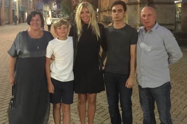 Natasha, centre, with her sons, and mum, left, and dad, right.