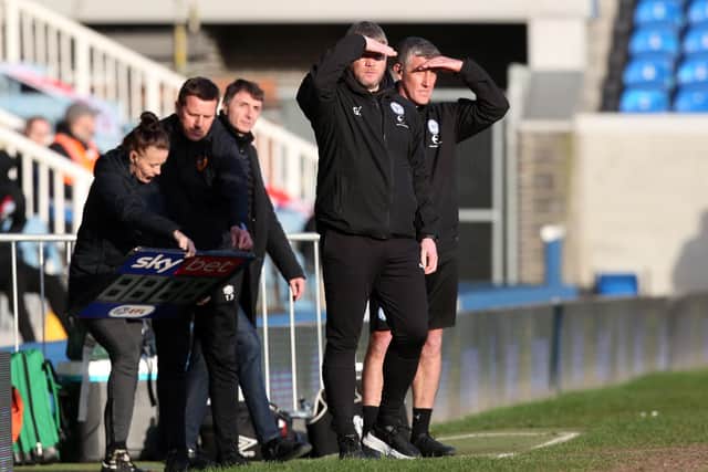 Grant McCann and his assistant Cliff Byrne watch Posh lose to Hull on Saturday. Photo: Joe Dent/theposh.com.