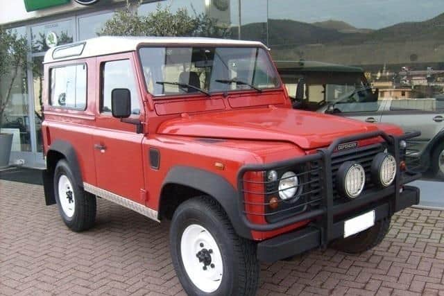 A red Land Rover Defender