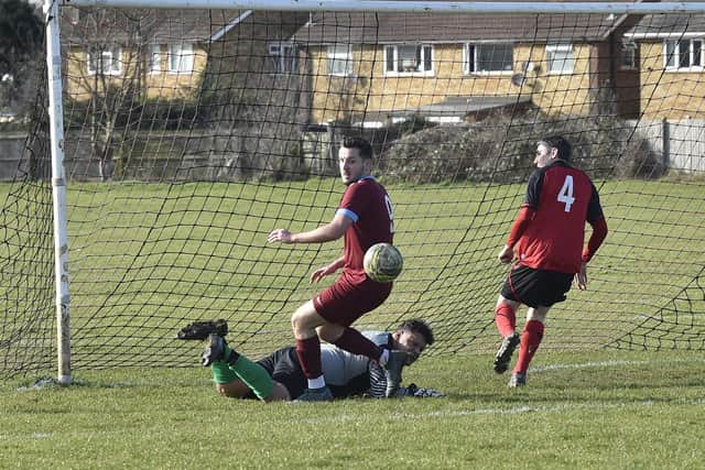 Michael Uff (9) scored for Thorpe Wood Rangers at Netherton A. Also pictured are Netherton goalkeeper Ricky Benson and teammate Craig Spink.  Photo: David Lowndes.