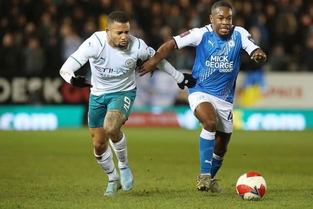 Posh midfielder Jeando Fuchs in action with Gabriel Jesus of Manchester City. Photo: Joe Dent.theposh/com.