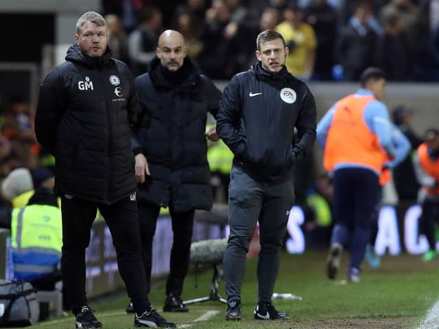 Posh boss Grant McCann (left) chats with Manchester City manager Pep Guardiola (centre) after the FA Cup clash this week. Photo; Joe Dent/theposh.com.