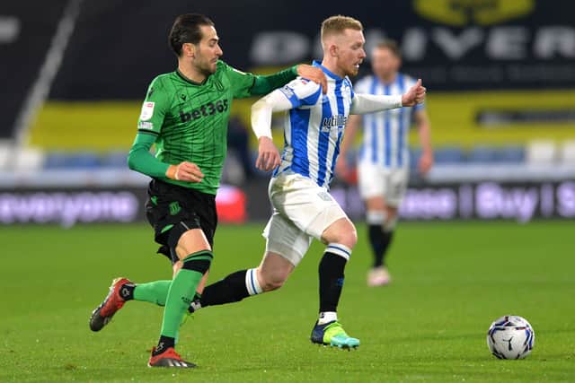 Lewis O'Brien (right) in action for Huddersfsield. Photo: PA Wire.