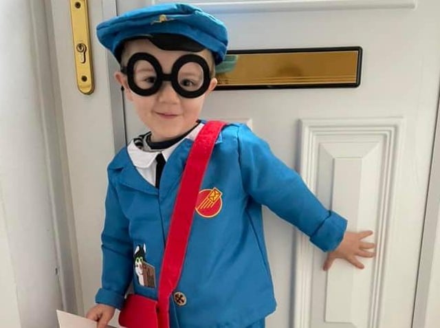 Toby Wilkinson, aged 3, dressed a s Postman Pat.