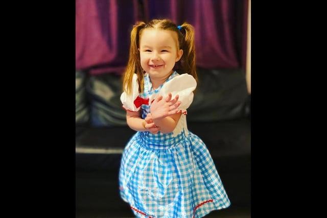 Sienna, dressed as Dorothy from The Wizard Of Oz, written by L. Frank Baum.