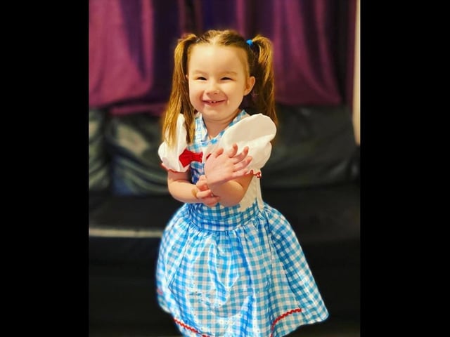 Sienna, dressed as Dorothy from The Wizard Of Oz, written by L. Frank Baum.