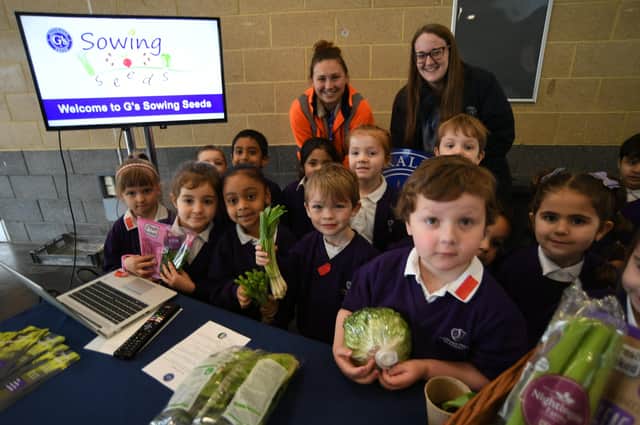 Pupils from  Newark Hill Primary School attending the Kids Country grow your own potatoes event at the East of England Arena pictured withMegan Beard and Megan Hudson from G's Fresh EMN-220203-140404009