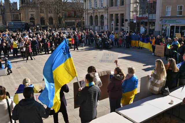 Protesters gather in Peterborough's Cathedral Square last week in support of Ukraine. A city law firm has offered to help residents tackle the paperwork needed to help relatives escape the war zone.