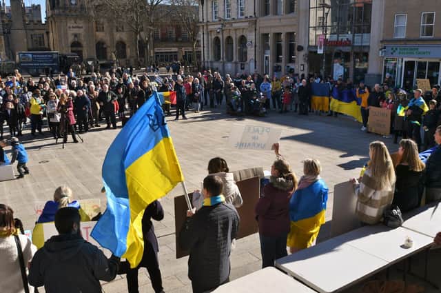 Protesters gather in Peterborough's Cathedral Square last week in support of Ukraine. A city law firm has offered to help residents tackle the paperwork needed to help relatives escape the war zone.