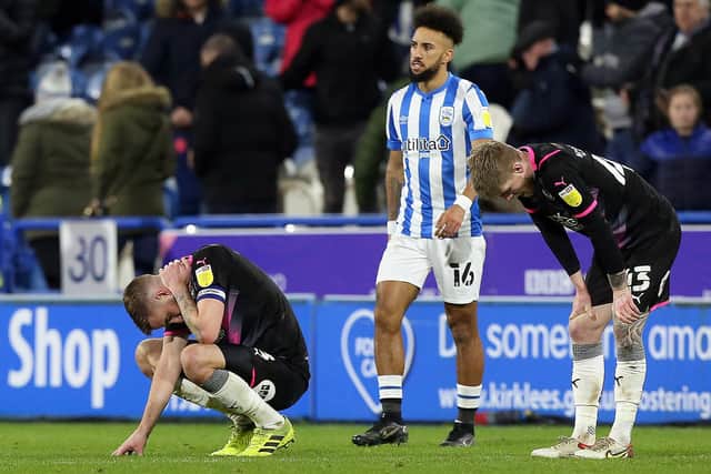Peterborough United's Mark Beevers and Hayden Coulson cut dejected figures at full-time. Photo: Joe Dent/theposh.com.