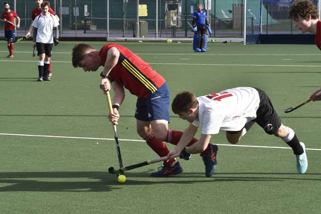 Alex Boxall of City of Peterborough avoids a diving tackle from a Deeside player. Photo: David Lowdes.