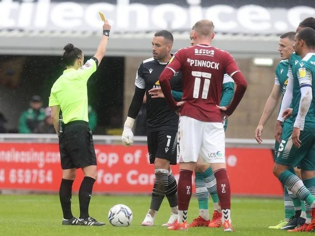 Dean Bouzanis is shown a yellow card by referee Rebecca Welch.
Photo: Getty Images