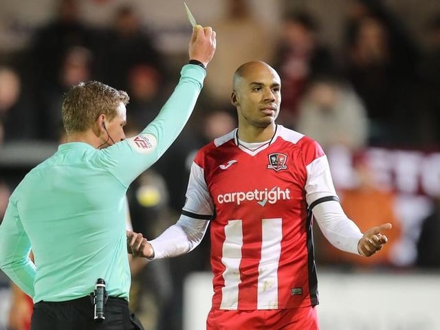 Jake Caprice of Exeter City is shown a yellow card.
Photo: Getty Images