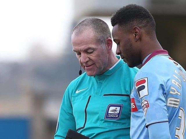 Referee Graham Salisbury takes the name of Jennison Myrie-Williams of Tranmere Rovers.
Photo: Getty Images