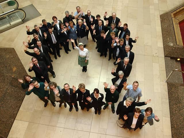 Queensgate 21st anniversary. Waitrose employee Sue Cox, 53, (centre), surrounded by fellow queensgate employees who have worked there since the grand opening 21yrs ago.
