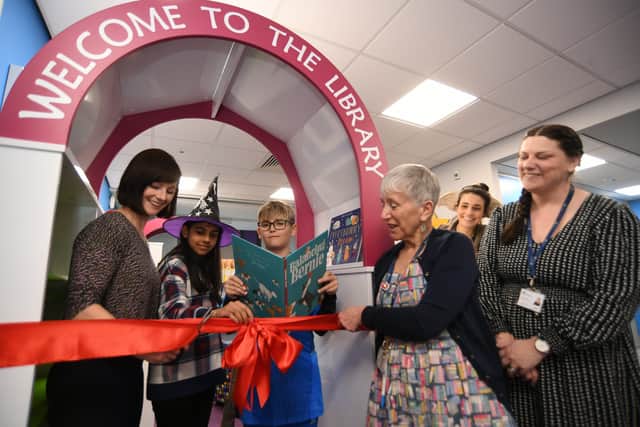 Childrens' author Ellie Sandall opening the new library at West Town primary school with head boy and girl Samiksha Mohapatro and Maurycy Urban with  school librarian Marie Watts,  the English lead Alix Doubleday and head teacher Hannah Quinn. EMN-220403-174118009