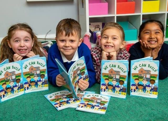 The children at Hampton Vale Primary Academy with We Can Build books from Barratt and David Wilson Homes.