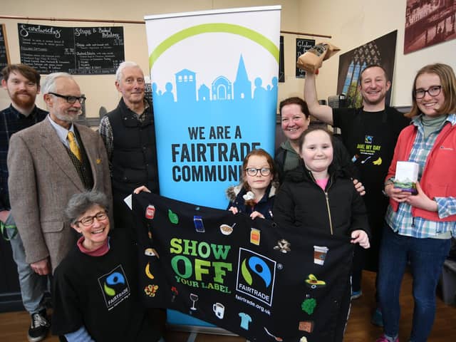 David Beever, owner of Sundays in Peterborough Cathedral precincts with members of the Peterborough Fairtrade Community