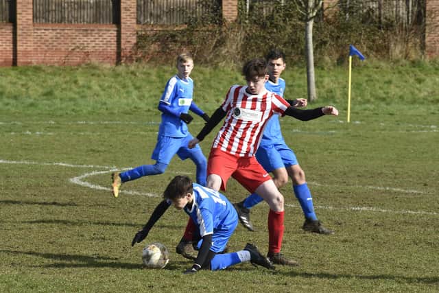 Action from One Touch and Hampton Robins (blue) in the Junior Alliance Under 14 League. One Touch won 4-0. Report and team pics in Thursday's PT. Photo: David Lowndes.