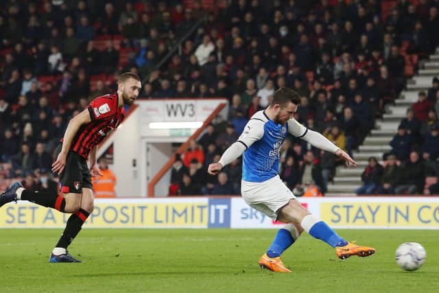 Jack Marriott of Peterborough United scores the 100th goal of his career at Bournemouth. Photo: Joe Dent/theposh.com.