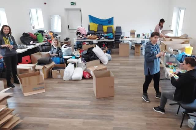 Collecting in Peterborough to help Ukrainian refugees. EMN-220103-113000005