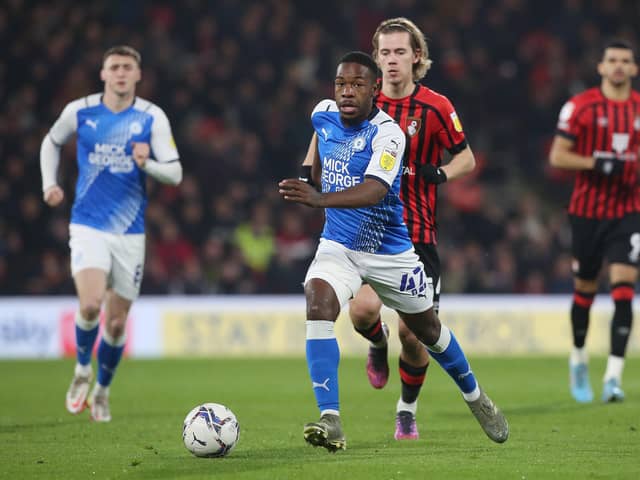 Jeando Fuchs of Peterborough United gets away from Todd Cantwell of Bournemouth. Photo: Joe Dent/theposh.com