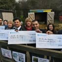 Cllr Shaz Nawaz, Cllr Aasiyah Joseph, Abdul Aziz (Adam's Cash and Carry), Ayaz Nawaz and Tania Chamera  (Blenheim Lettings) and Ansar Ali (Goldstar Taxis) presenting cheques to staff at New Ark Adventure Playground. EMN-220903-165318009