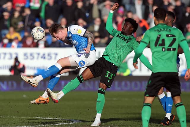 Frankie Kent of Peterborough United battles with Josh Maja of Stoke City. Photo: Joe Dent/theposh.com.
