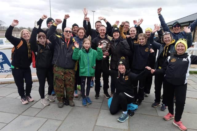 Yaxley Runners celebrate their Frostbite League success.