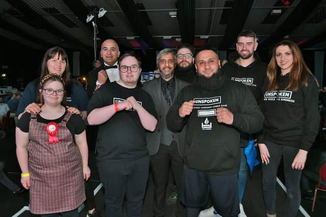 Y5 White Collar Boxing Promotor Masoom Ajaib with volunteers from Unspoken charity with youngsters from the Peterborough Down Syndrome Group at a boxing show at Spalding where funds were raised for the Peterborough Group.