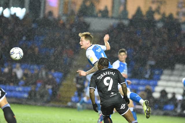 Posh defender Frankie Kent heads the ball clear in the game against Swansea. Photo: David Lowndes.