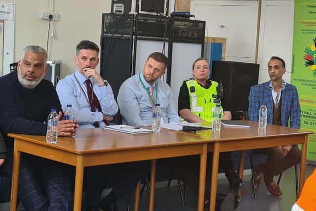Cllr Nawaz (right) meets with police and residents