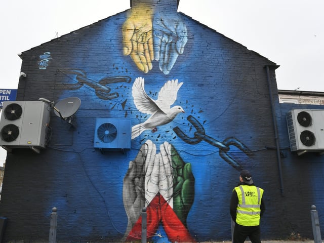 The peace mural at Millfield Convenience Store, Lincoln Road EMN-220316-152200009