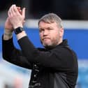 Posh boss Grant McCann applauds the fans at the end of the game at QPR. Photo: Joe Dent/theposh.com.