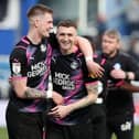 Josh Knight (left) and Jack Taylor of Peterborough United celebrate  victory at QPR at full-time. Photo: Joe Dent/theposh.com.