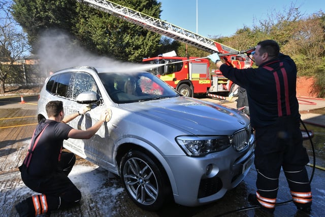 Stanground and Dogsthorpe fire fighters doing their annual charity car wash at Stanground Fire Station. EMN-220319-101455009