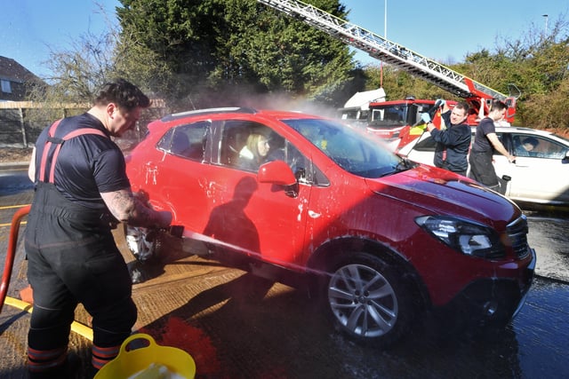 Stanground and Dogsthorpe fire fighters doing their annual charity car wash at Stanground Fire Station. EMN-220319-101506009