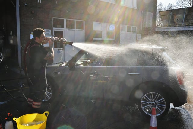 Stanground and Dogsthorpe fire fighters doing their annual charity car wash at Stanground Fire Station. EMN-220319-101359009