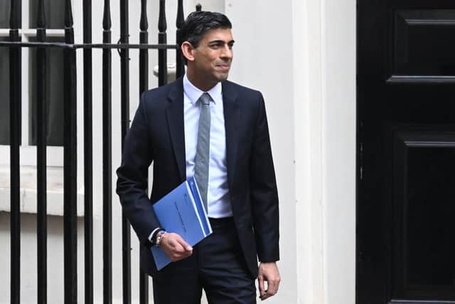 Chancellor of the Exchequer Rishi Sunak leaves 11 Downing Street for the House of Commons to deliver his Spring Statement on March 23. (Photo by Leon Neal/Getty Images)