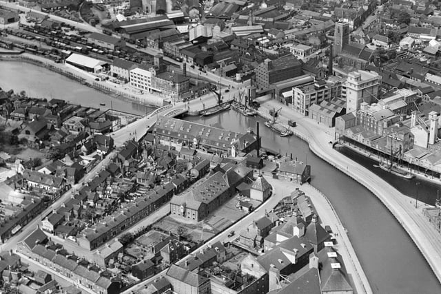 Photograph of the Stoke Bridge Wharf, Ipswich taken in May 1933. The port of Ipswich has been a centre of trade since the Saxon period. The warehouses, railway siding and boast indicate the importance of the port as a commercial centre. (Photo: Historic England)