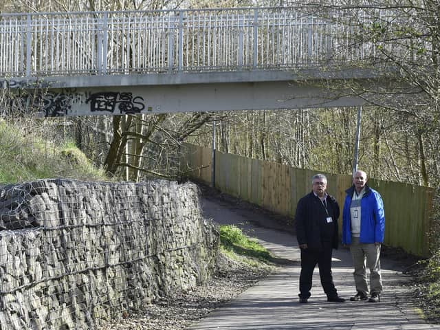 Former councillor John Peach (right) pictured with councillor Bryan Tyler (left) who has launched his 'Safety First' campaign to enclose a footbridge over the A15 and make roads safer for drivers.