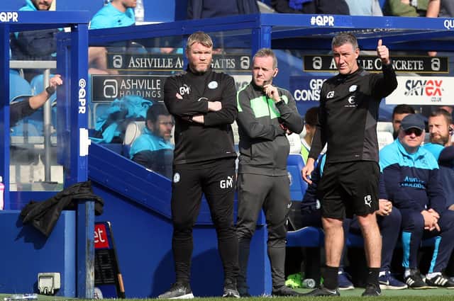 Peterborough United Manager Grant McCann and his assistant  Cliff Byrne on the touchline at Queens Park Rangers. Photo: Joe Dent/theposh.com.