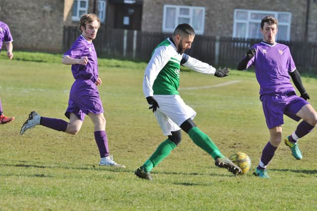 FC Peterborough (green) in action at Fulbridge Road.