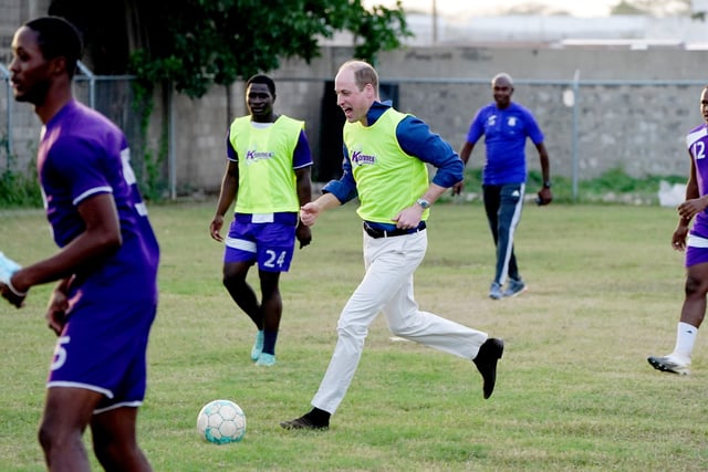 The Duke of Cambridge joins young footballers on the football pitch during a visit to Trenchtown in Kingston, Jamaica, on day four of their tour of the Caribbean on behalf of the Queen to mark her Platinum Jubilee. Picture date: Tuesday March 22, 2022. EMN-220323-131249005