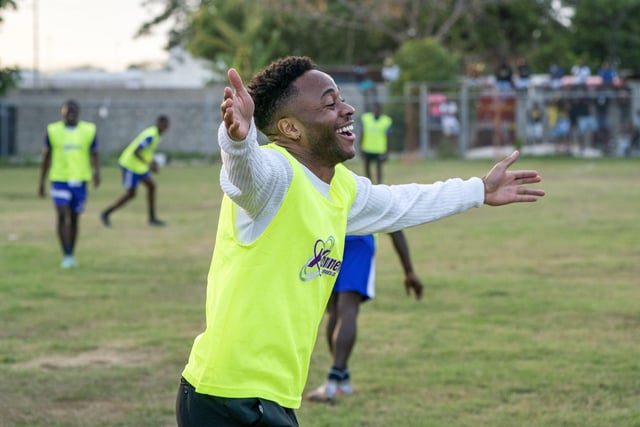 Manchester City and England's Raheem Sterling during a game of football with the Duke of Cambridge and young local footballers during a visit to Trenchtown in Kingston, Jamaica, on day four of their tour of the Caribbean on behalf of the Queen to mark her Platinum Jubilee. Picture date: Tuesday March 22, 2022. EMN-220323-131225005
