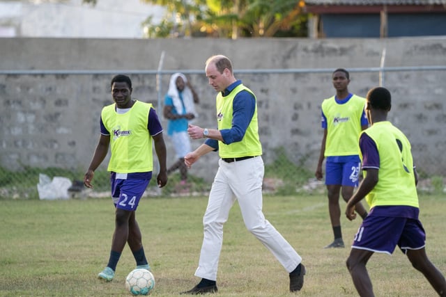 The Duke of Cambridge joins young footballers on the football pitch during a visit to Trenchtown in Kingston, Jamaica, on day four of their tour of the Caribbean on behalf of the Queen to mark her Platinum Jubilee. Picture date: Tuesday March 22, 2022. EMN-220323-131326005