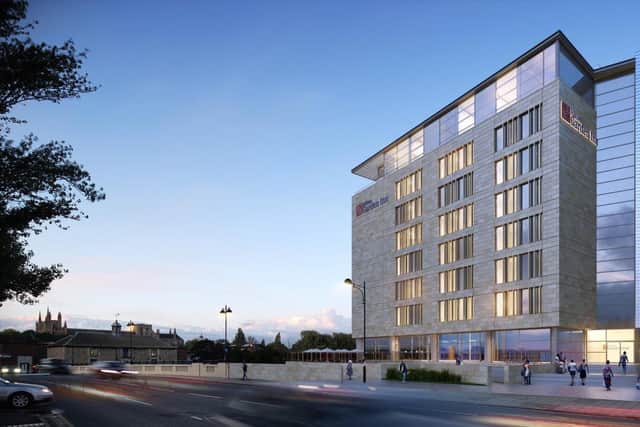 This image shows how the Hilton Garden Inn will appear once completed. EMN-220323-120507005
