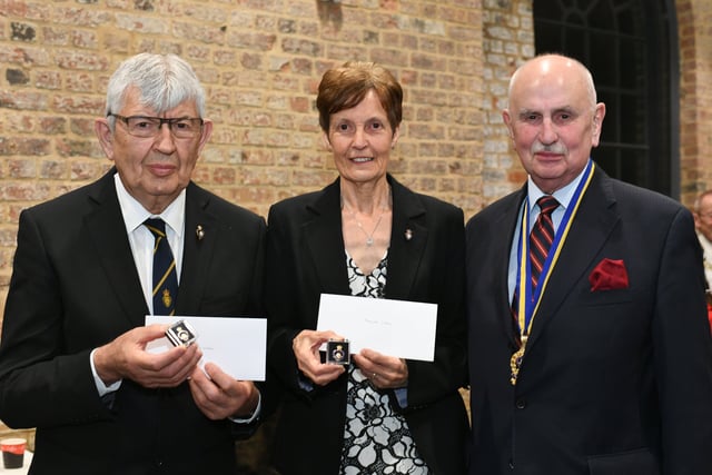 Jerry and Margaret Wilson receive gold awards from Major Elsey of the  Peterborough Branch of the Royal British Legion EMN-220325-095420009